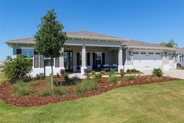 9764 SW 81st Ln, Ocala, FL 34481 - view of front of property with stucco siding, decorative driveway, a front yard, and a garage