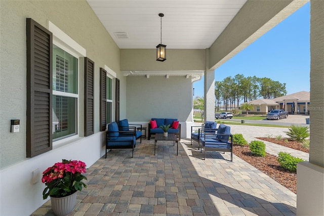 9764 SW 81st Ln, Ocala, FL 34481 - view of patio featuring visible vents and an outdoor living space