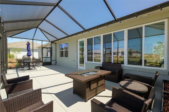 9764 SW 81st Ln, Ocala, FL 34481 - view of patio / terrace featuring glass enclosure, outdoor dining space, and an outdoor fire pit