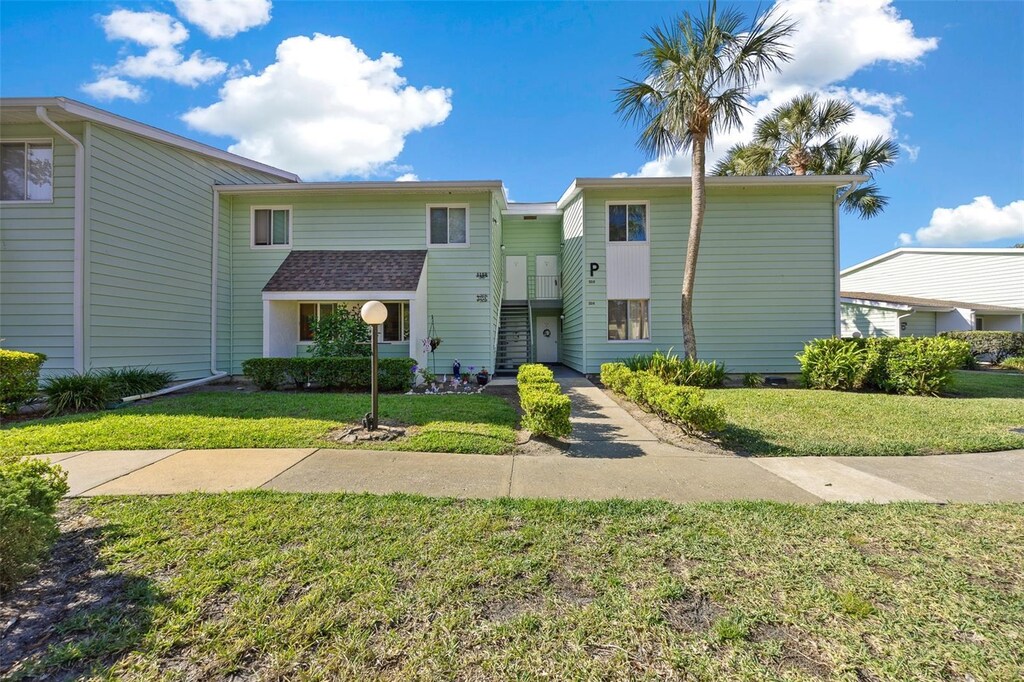 515 Midway Dr Unit A, Ocala, FL 34472 - view of front facade with a front lawn