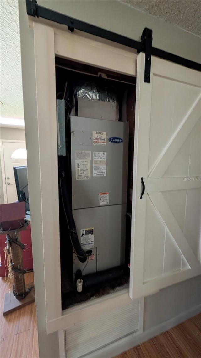 utility room featuring heating unit