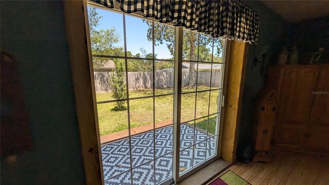 2219 NE 18th Ave, Ocala, FL 34470 - entryway with wood finished floors and healthy amount of natural light