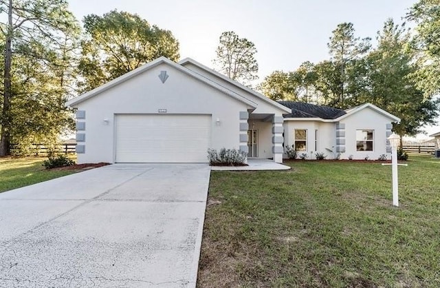 single story home featuring driveway, stucco siding, and fence