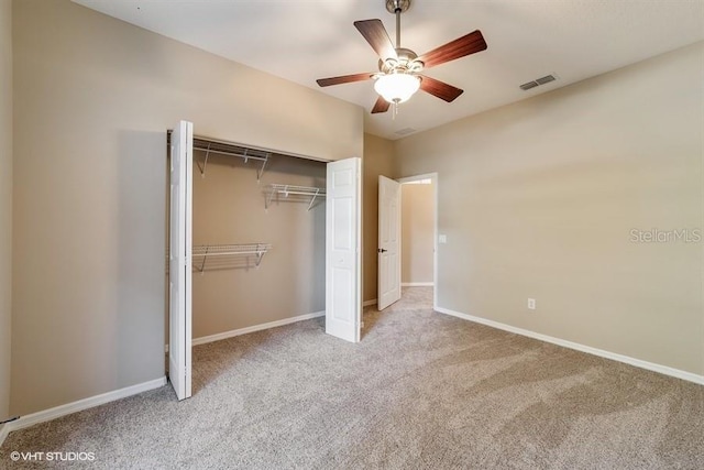 unfurnished bedroom featuring visible vents, a ceiling fan, carpet floors, a closet, and baseboards