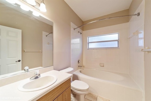 bathroom with washtub / shower combination, toilet, vanity, and tile patterned floors