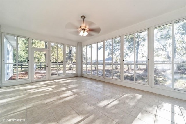 unfurnished sunroom featuring tile patterned floors