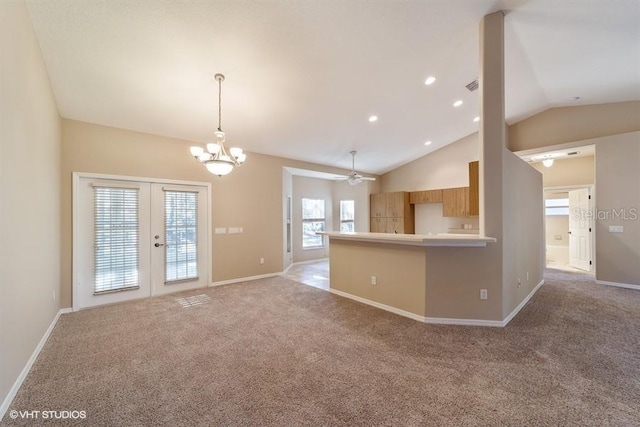 kitchen with vaulted ceiling, baseboards, carpet, and french doors