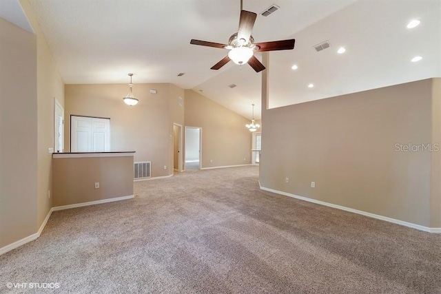 spare room featuring light colored carpet, baseboards, a ceiling fan, and visible vents