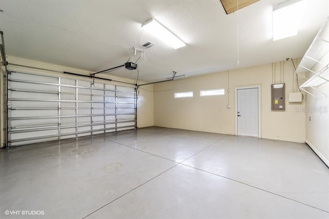 garage featuring a garage door opener and electric panel