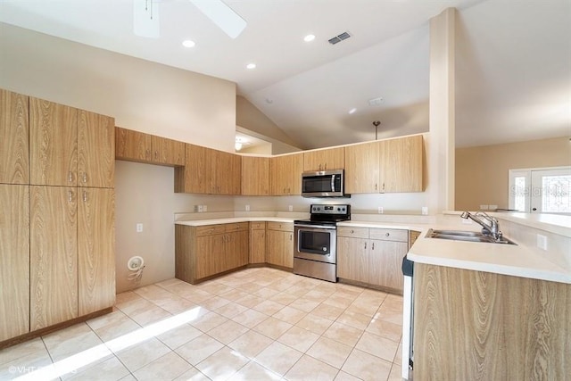 kitchen featuring a sink, visible vents, appliances with stainless steel finishes, light countertops, and light tile patterned floors