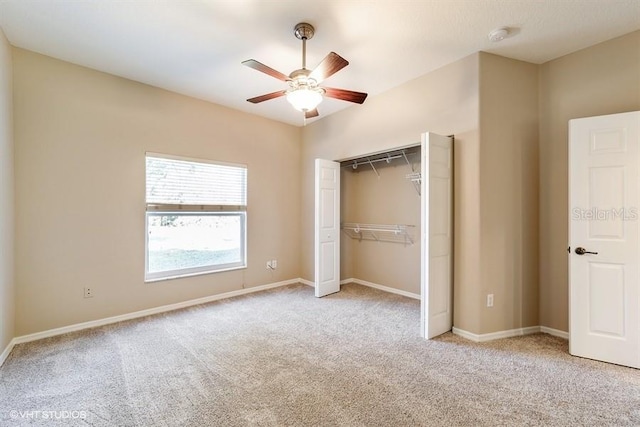 unfurnished bedroom featuring ceiling fan, baseboards, a closet, and light colored carpet