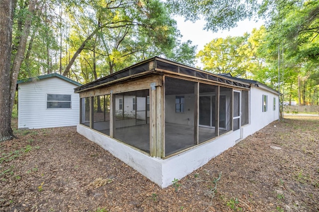 view of side of property with a sunroom