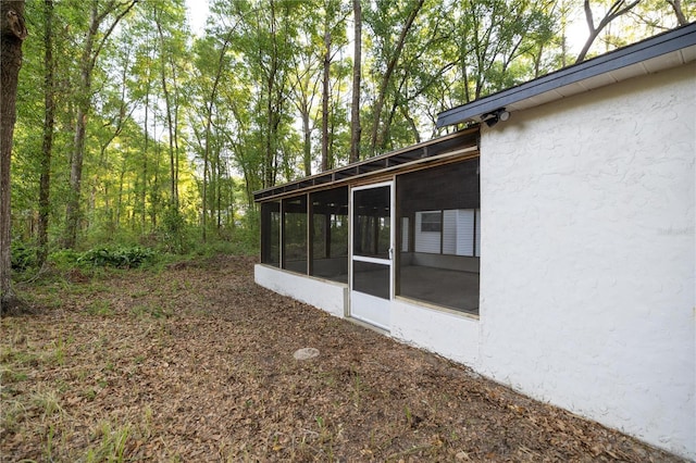 view of yard featuring a sunroom