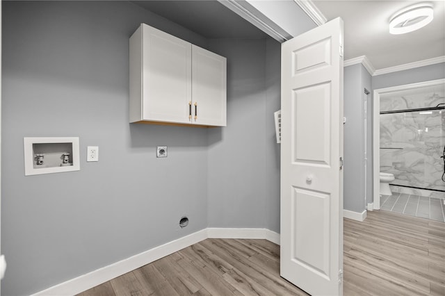 laundry room with hookup for an electric dryer, baseboards, light wood-style floors, hookup for a washing machine, and cabinet space