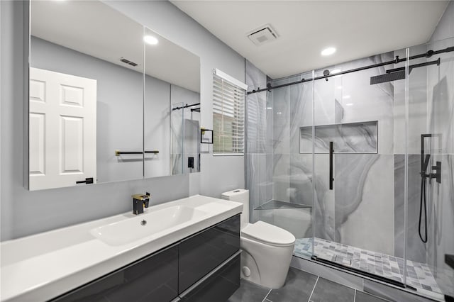 full bathroom with a shower stall, visible vents, toilet, and vanity
