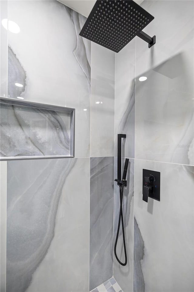 room details with a marble finish shower