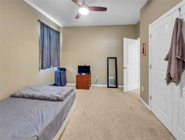 5198 NE 19th Pl, Ocala, FL 34470 - bedroom with light carpet, a ceiling fan, and baseboards