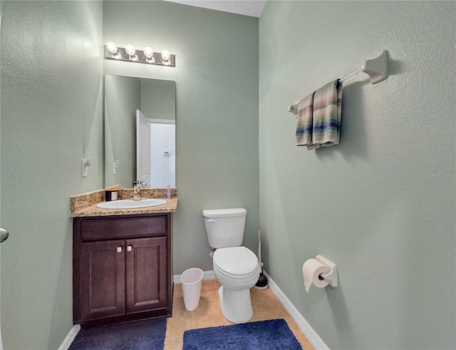 5198 NE 19th Pl, Ocala, FL 34470 - half bathroom featuring baseboards, vanity, and toilet