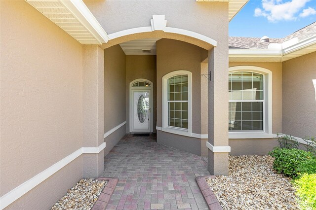 8632 SW 86th Cir, Ocala, FL 34481 - doorway to property featuring stucco siding