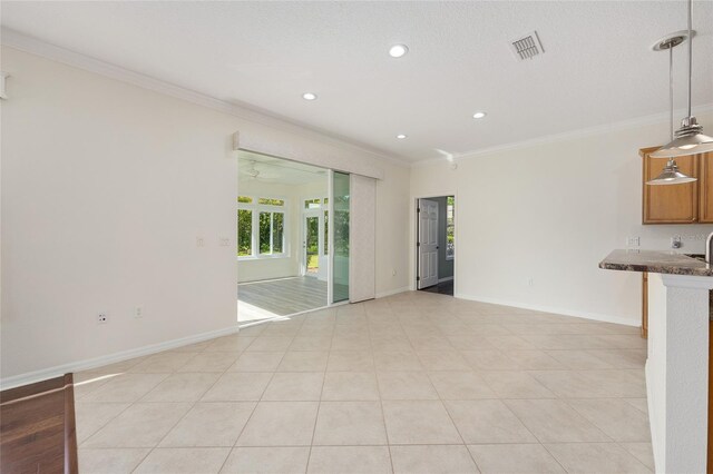 8632 SW 86th Cir, Ocala, FL 34481 - unfurnished living room featuring recessed lighting, baseboards, visible vents, and ornamental molding