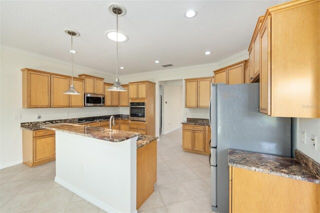 8632 SW 86th Cir, Ocala, FL 34481 - kitchen featuring a kitchen island with sink, decorative light fixtures, dark stone countertops, ornamental molding, and stainless steel appliances