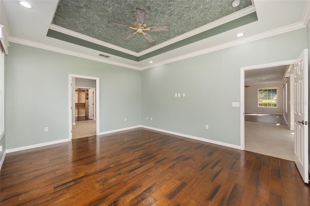 8632 SW 86th Cir, Ocala, FL 34481 - unfurnished bedroom with baseboards, a tray ceiling, hardwood / wood-style flooring, and visible vents