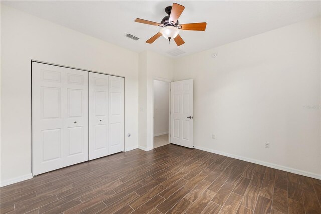 8632 SW 86th Cir, Ocala, FL 34481 - unfurnished bedroom featuring baseboards, visible vents, dark wood finished floors, and a closet
