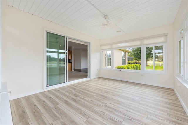 8632 SW 86th Cir, Ocala, FL 34481 - unfurnished sunroom featuring baseboards, a healthy amount of sunlight, and wood finished floors