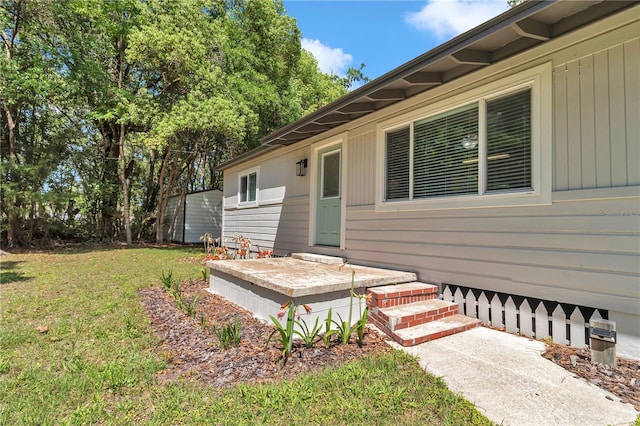 4180 W Anthony Rd, Ocala, FL 34475 - doorway to property featuring a lawn