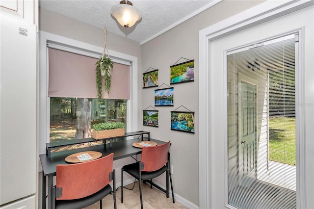 4180 W Anthony Rd, Ocala, FL 34475 - tiled dining area with baseboards and a textured ceiling