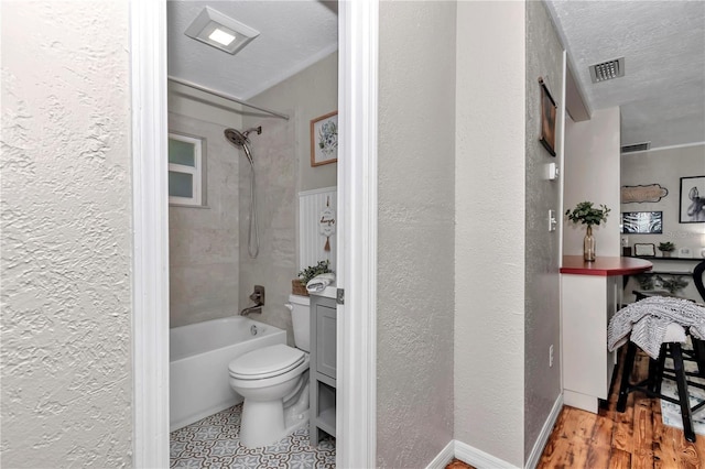 4180 W Anthony Rd, Ocala, FL 34475 - full bathroom with toilet, a textured wall, shower / tub combination, and visible vents