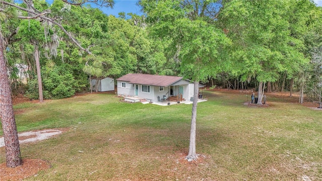 4180 W Anthony Rd, Ocala, FL 34475 - view of front of home featuring a patio area, an outbuilding, and a front yard