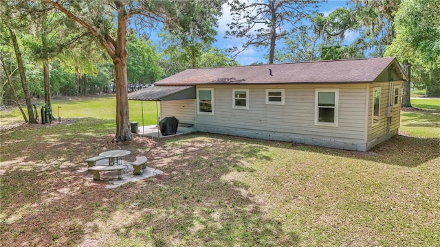 4180 W Anthony Rd, Ocala, FL 34475 - rear view of property featuring a patio area and a yard