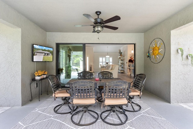 view of patio / terrace with a ceiling fan and outdoor dining space
