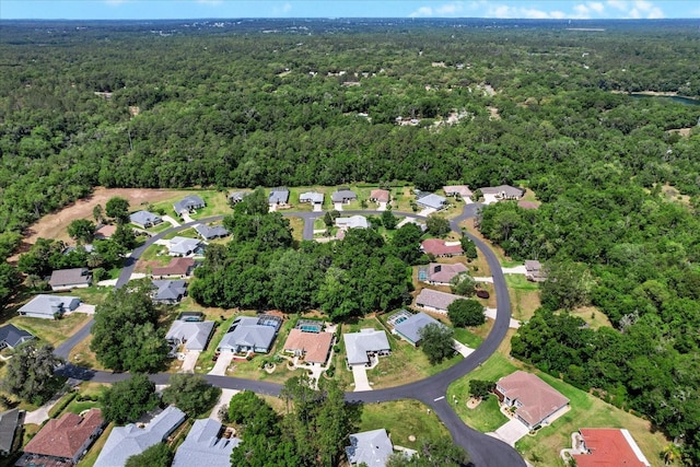 aerial view featuring a residential view and a wooded view