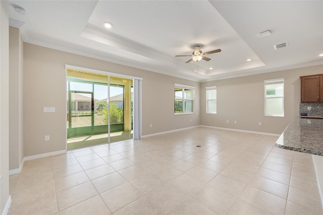 8952 SW 79th Ln, Ocala, FL 34481 - unfurnished living room with ceiling fan, crown molding, a tray ceiling, and recessed lighting