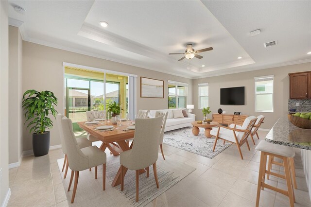 8952 SW 79th Ln, Ocala, FL 34481 - dining room with a ceiling fan, a tray ceiling, recessed lighting, and a healthy amount of sunlight