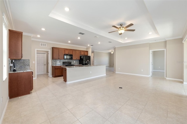 8952 SW 79th Ln, Ocala, FL 34481 - unfurnished living room featuring a raised ceiling, visible vents, a ceiling fan, and crown molding