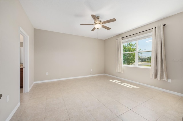 8952 SW 79th Ln, Ocala, FL 34481 - spare room featuring ceiling fan, baseboards, and light tile patterned floors
