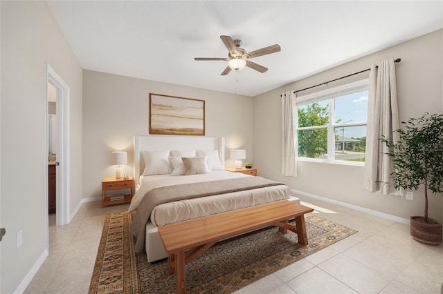 8952 SW 79th Ln, Ocala, FL 34481 - bedroom with baseboards, ceiling fan, and light tile patterned floors