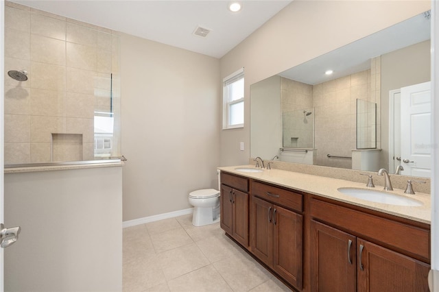 8952 SW 79th Ln, Ocala, FL 34481 - bathroom featuring double vanity, visible vents, a walk in shower, and a sink