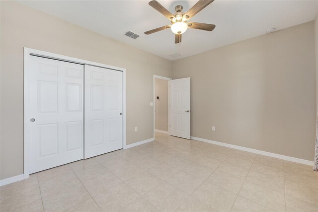 8952 SW 79th Ln, Ocala, FL 34481 - unfurnished bedroom with a closet, visible vents, a ceiling fan, and baseboards