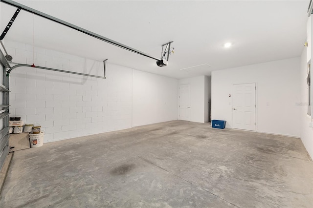 8952 SW 79th Ln, Ocala, FL 34481 - garage with a garage door opener and concrete block wall