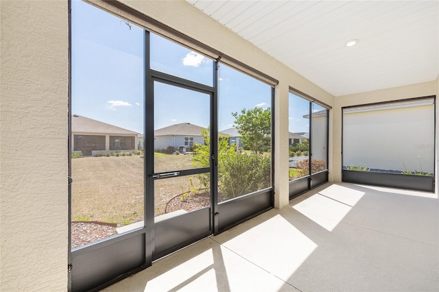 8952 SW 79th Ln, Ocala, FL 34481 - unfurnished sunroom featuring a residential view