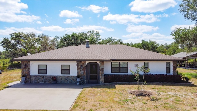 4806 SW County Road 769, Arcadia, FL 34269 - single story home with stucco siding, a shingled roof, stone siding, and a front lawn