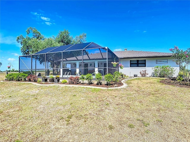 4806 SW County Road 769, Arcadia, FL 34269 - back of property with a lawn, a lanai, and stucco siding