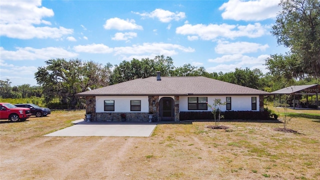 4806 SW County Road 769, Arcadia, FL 34269 - view of front of home with stucco siding, a front yard, and stone siding