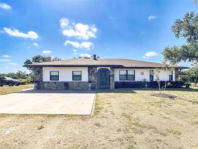 4806 SW County Road 769, Arcadia, FL 34269 - ranch-style house with stucco siding, a front lawn, and stone siding