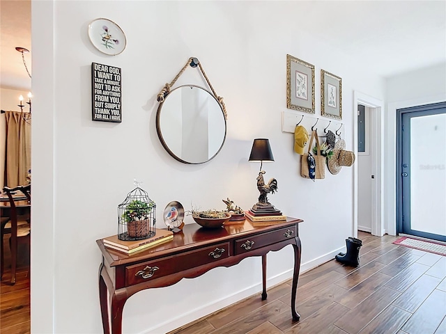 4806 SW County Road 769, Arcadia, FL 34269 - interior space featuring baseboards, a notable chandelier, and wood finished floors