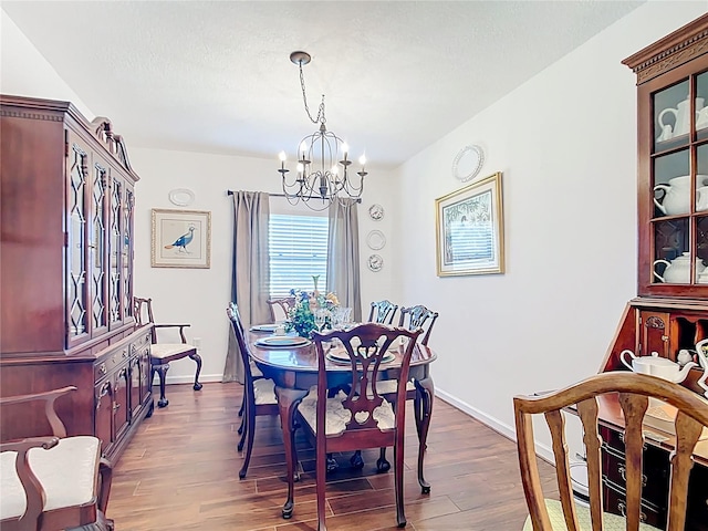 4806 SW County Road 769, Arcadia, FL 34269 - dining room with baseboards, an inviting chandelier, and wood finished floors